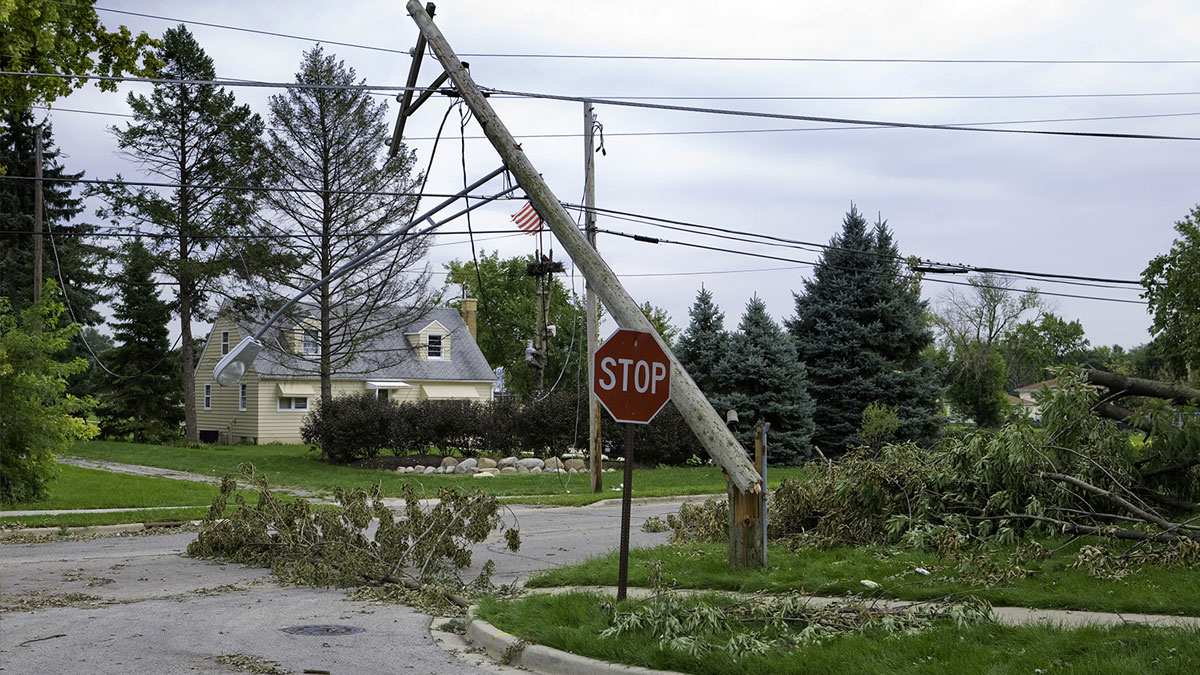 Downed power line and debris on street