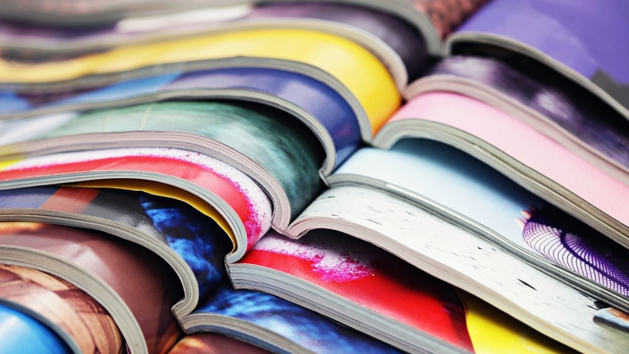 A stack of open journals.