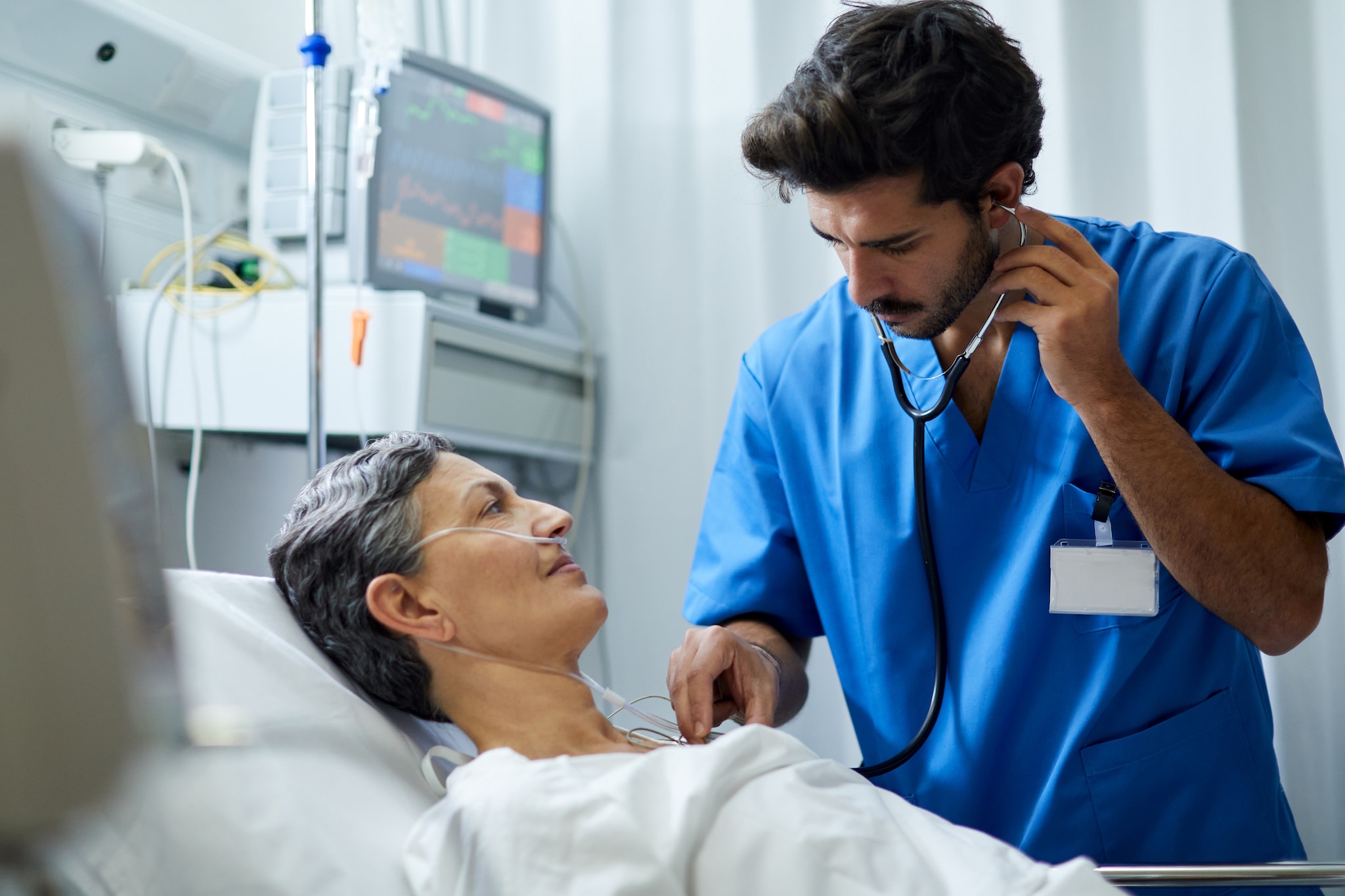 A hospital patient being checked by a healthcare provider