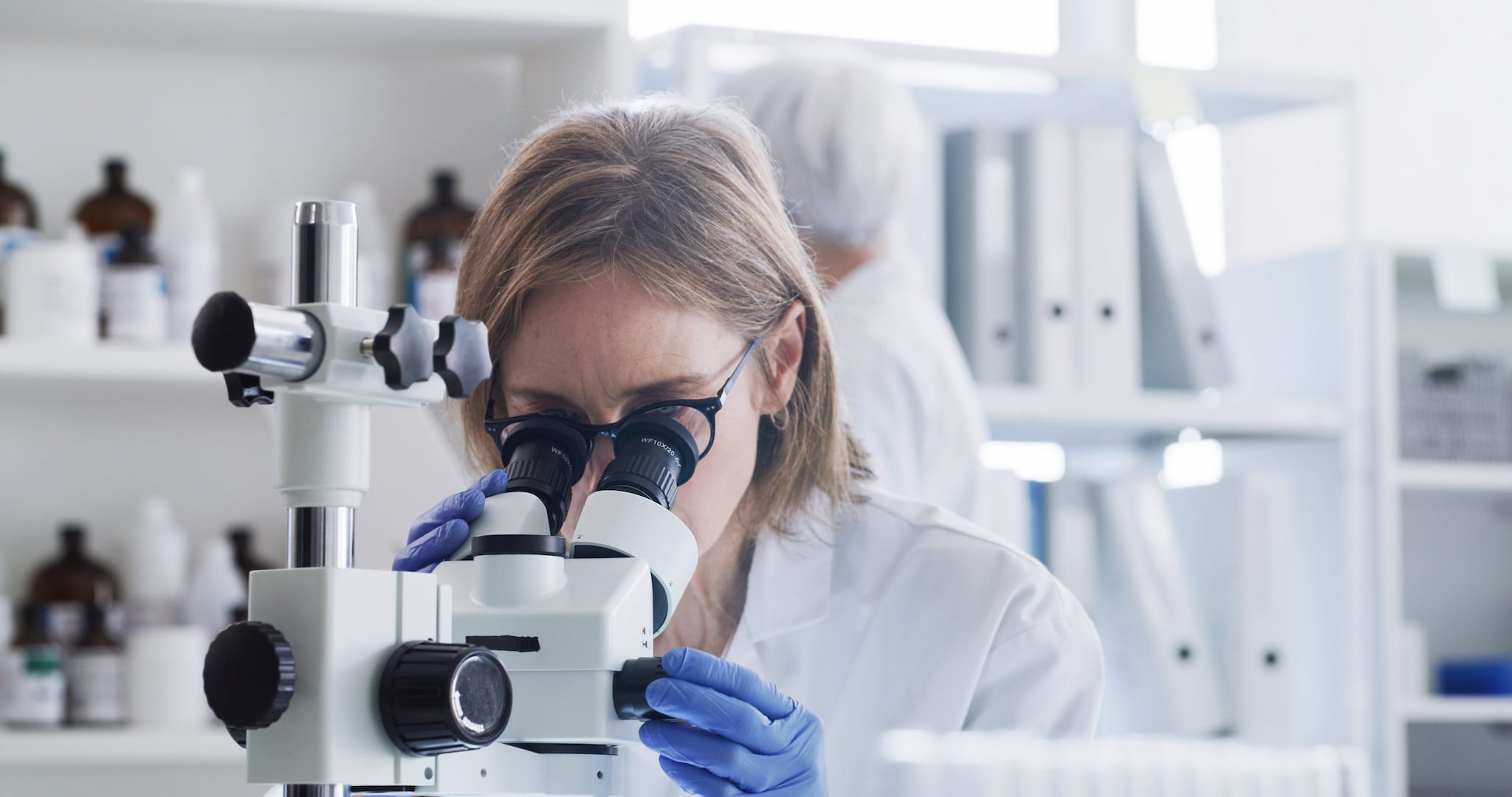 Photo of a researcher using a microscope