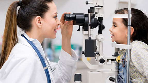 young girl getting eye exam