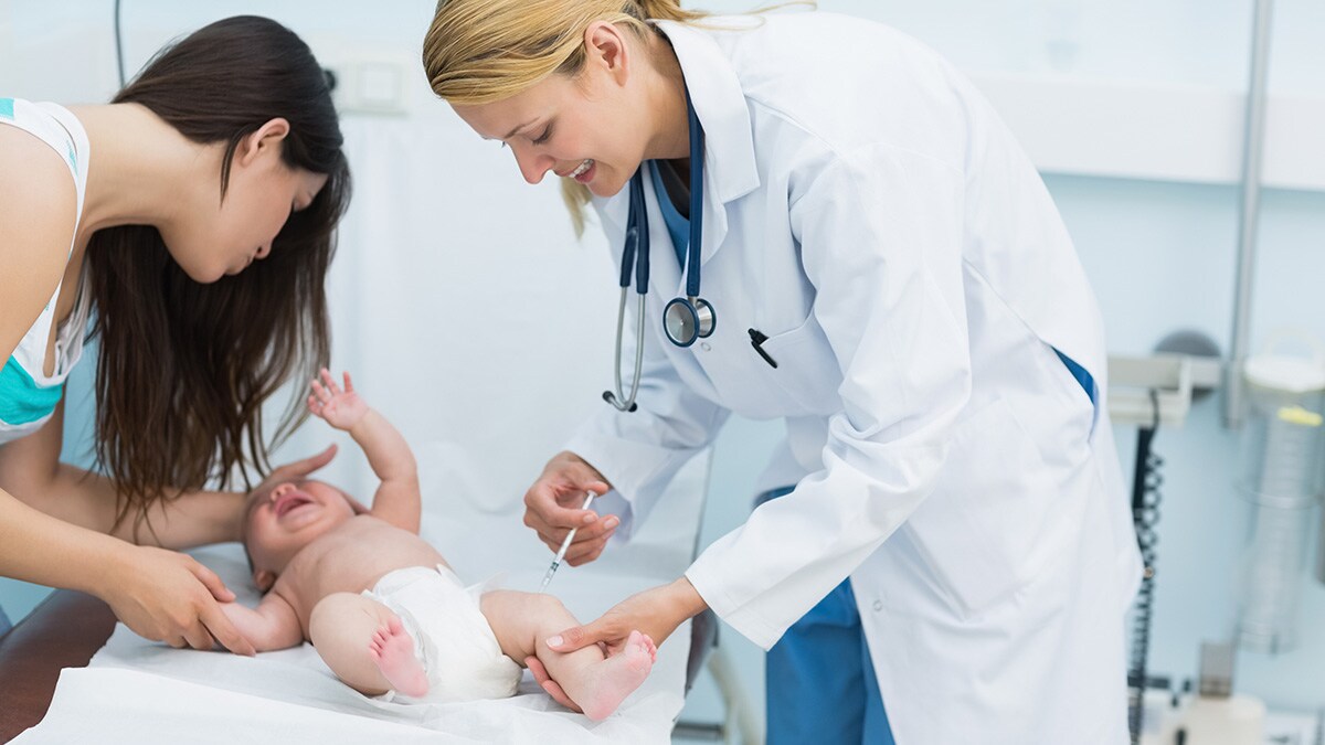 Newborn getting a vitamin K shot