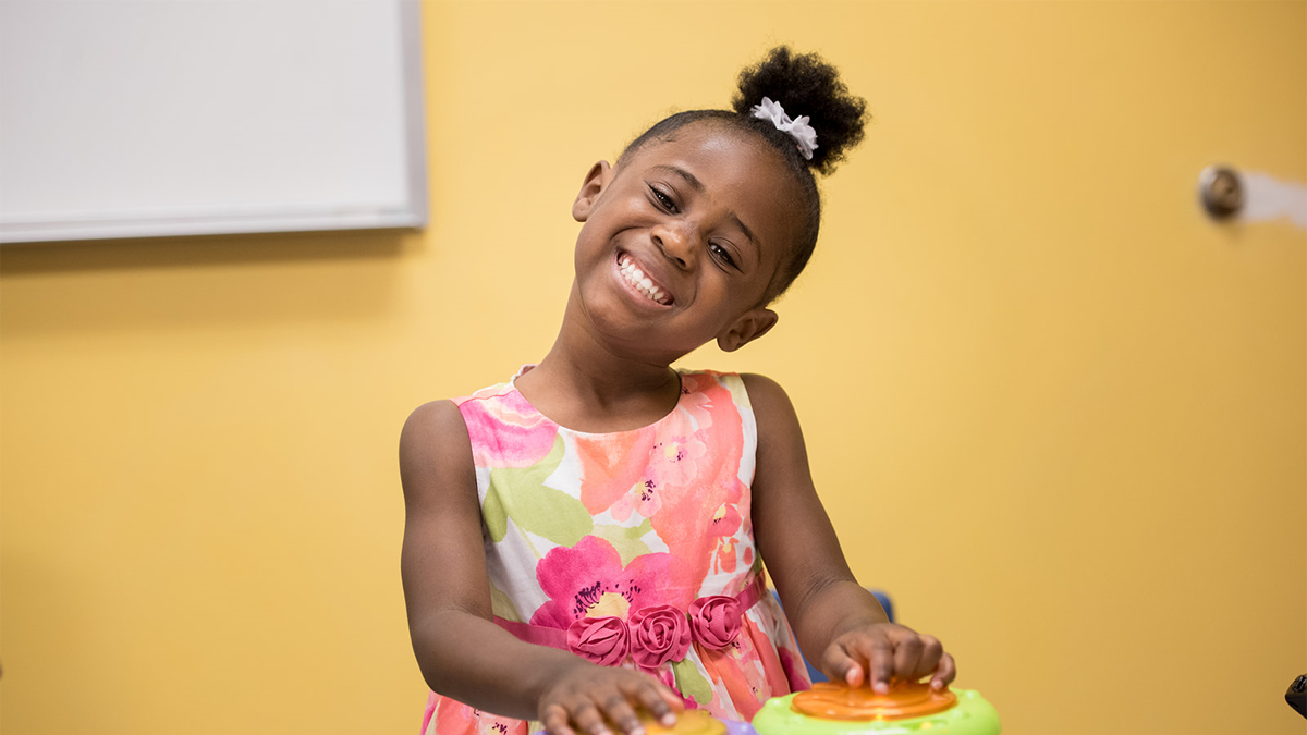 Young girl playing drums