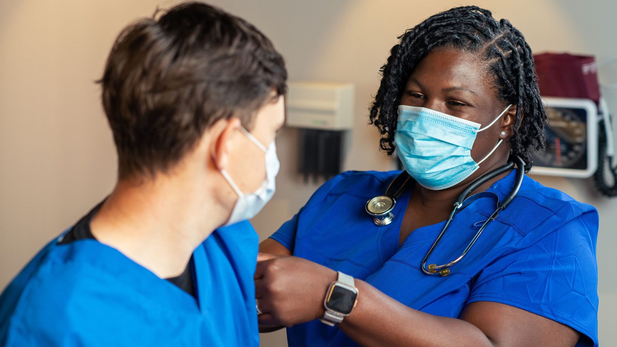 Provider putting a bandage on a patient